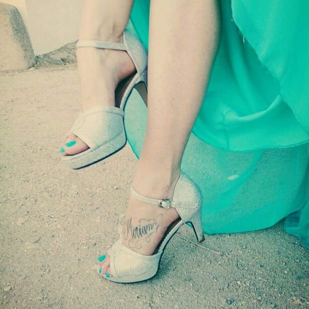 Sexy feet and legs with tattoo