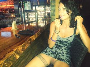 upskirt peek sitting at the bar