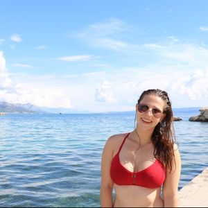 Big tits stretching her top so you can see her nipples