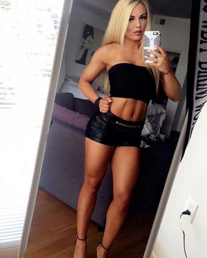 Amands shows off her beautifully toned legs in tight leather mini skirt
