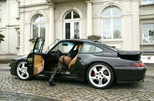 Hot babe in a hot car