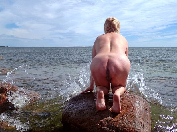 Mature Mermaid on the Rock