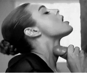 Putting her fragrance on, before leaving for work.