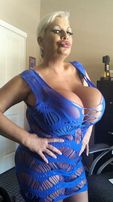 My huge fake juggs and fat Booty squeezed in a tight blue dress
