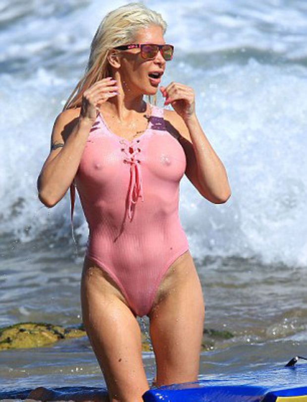 Hot blonde all wet in a tight one piece