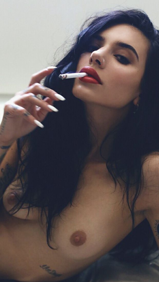 Stunning brunette smoking