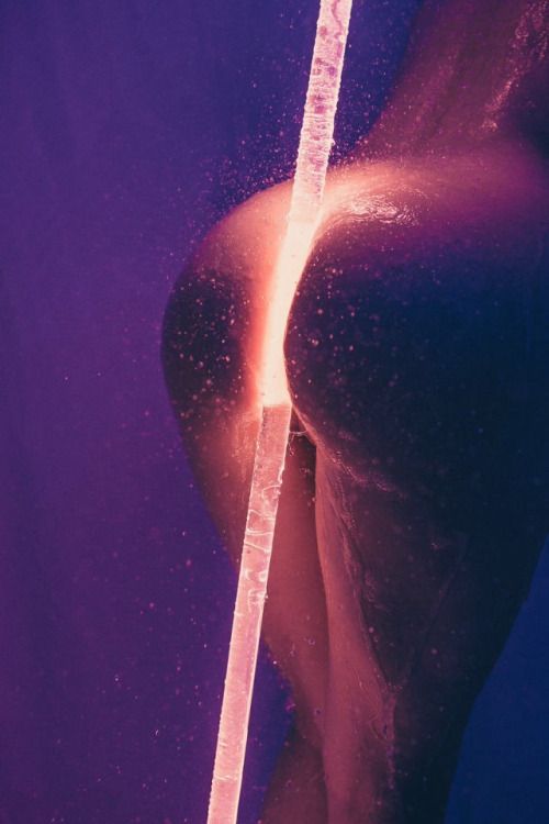 Wet neon poledancer