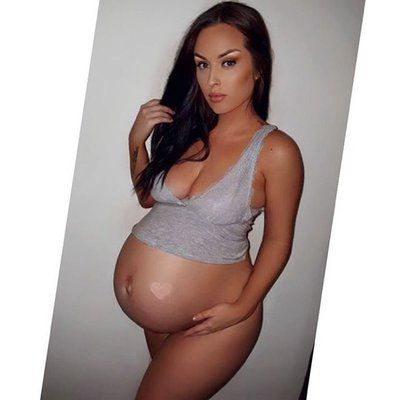 Pregnant cutie in sexy top