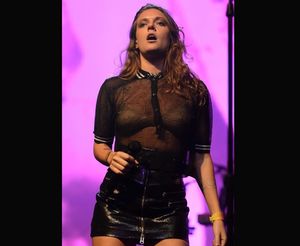 Tove Lo performing in a see through dress.