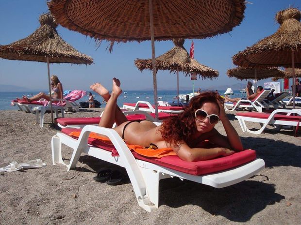 Buttcrack seen while lying prone on lounge chair