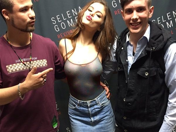 Selena Gomez with fans, showing off her boobs.