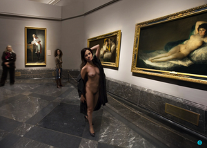 She flashes her body naked in the museum by the nude pictures.