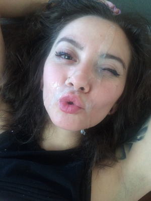 Brunette with cum on her face