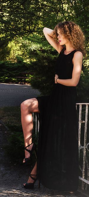 Leggy blonde model in low cut dress