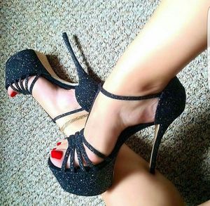sexy feet with red toenails in black heels