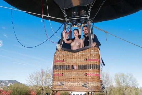 She's going on a hot air balloon ride naked.