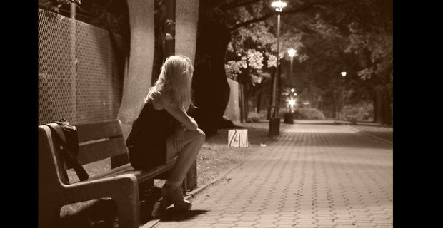 On a bench in a green alley