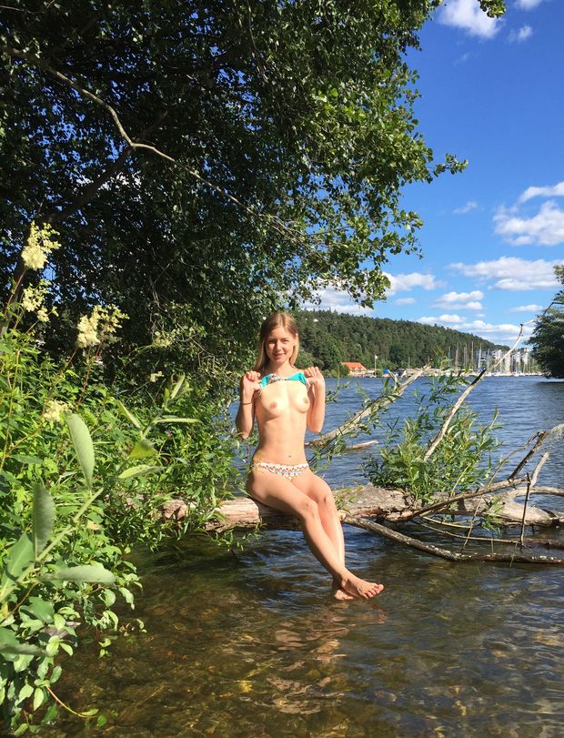 Sweet blonde petite girlfriend flashing her small tits by the lake
