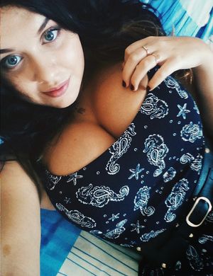 Stacked brunette with blue eyes