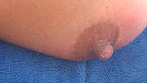 Hard nipple playing in the sand