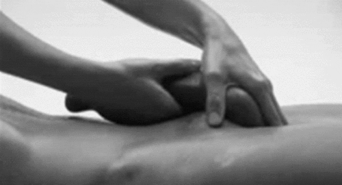 Stroking the balls and massaging the shaft.