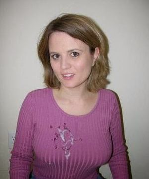 Neatly dressed woman in sweater with cum all over it