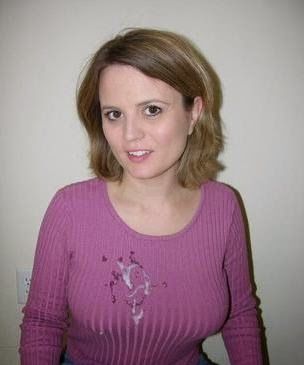 Neatly dressed woman in sweater with cum all over it