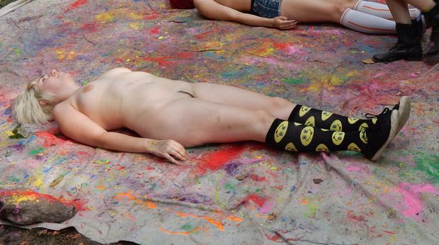 Laying there ready to be painted, but if this was in her bed, she'd be ready to take a penis deep in her vagina