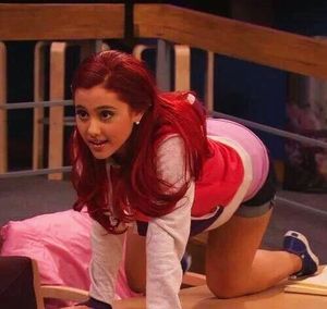 Ariana Grande crawling on bed