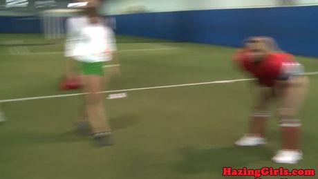 College teens pusslick on football field