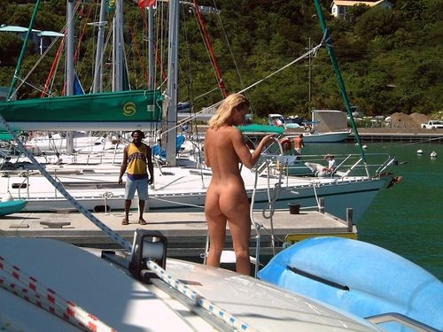 naked GF gets the boat ready, with an interested gawker