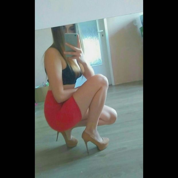 Blonde bimbo taking mirror shot in new tight red mini skirt
