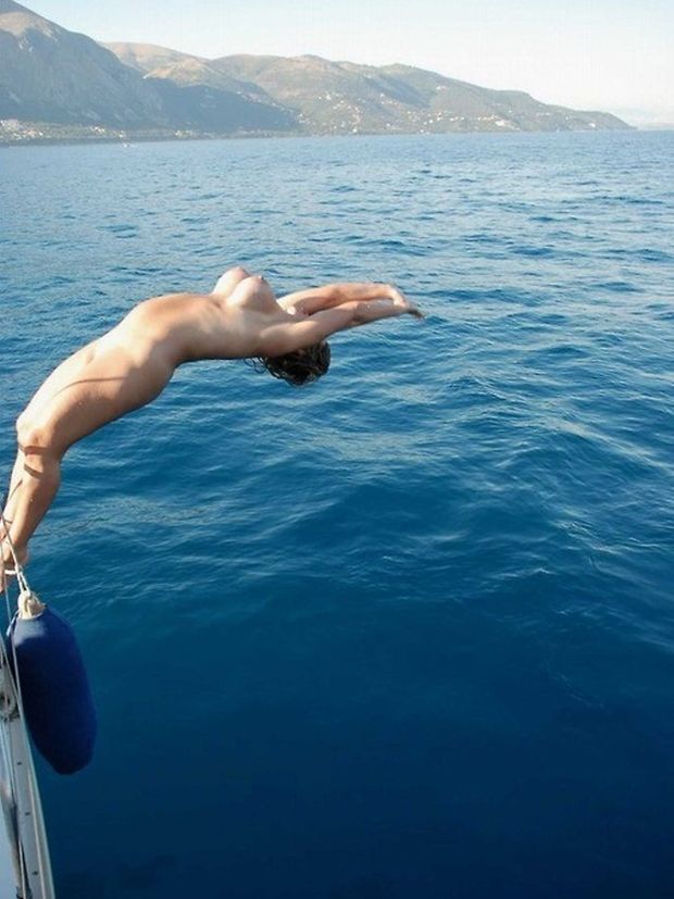 Naked backdive off the boat.