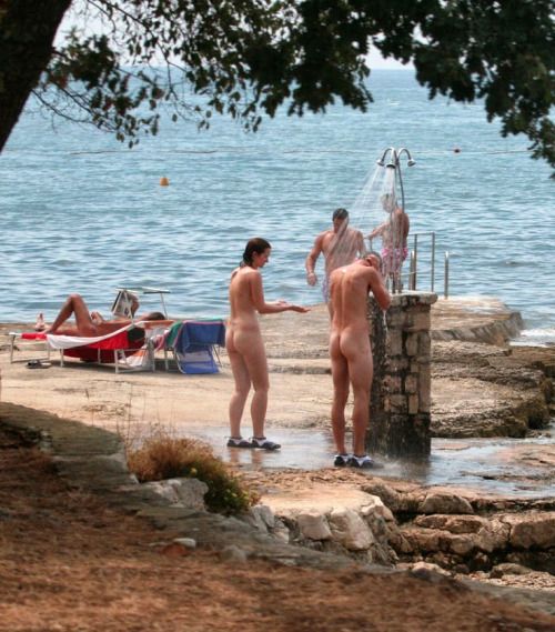 coed naked outdoor shower