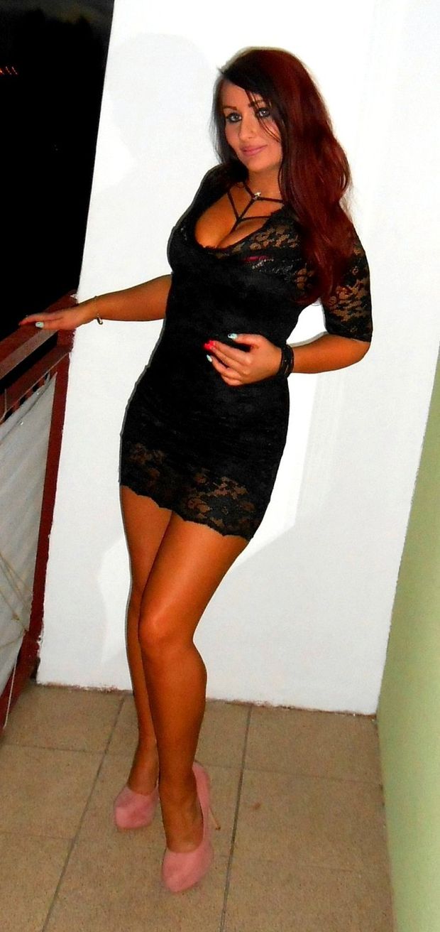 Redhead bimbo posing in tight slutty dress
