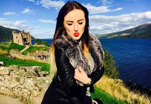 Brunette bimbo posing outdoors