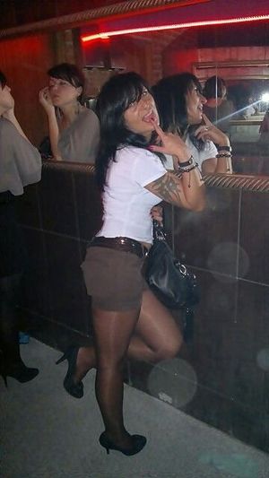 Tanned brunette at the party