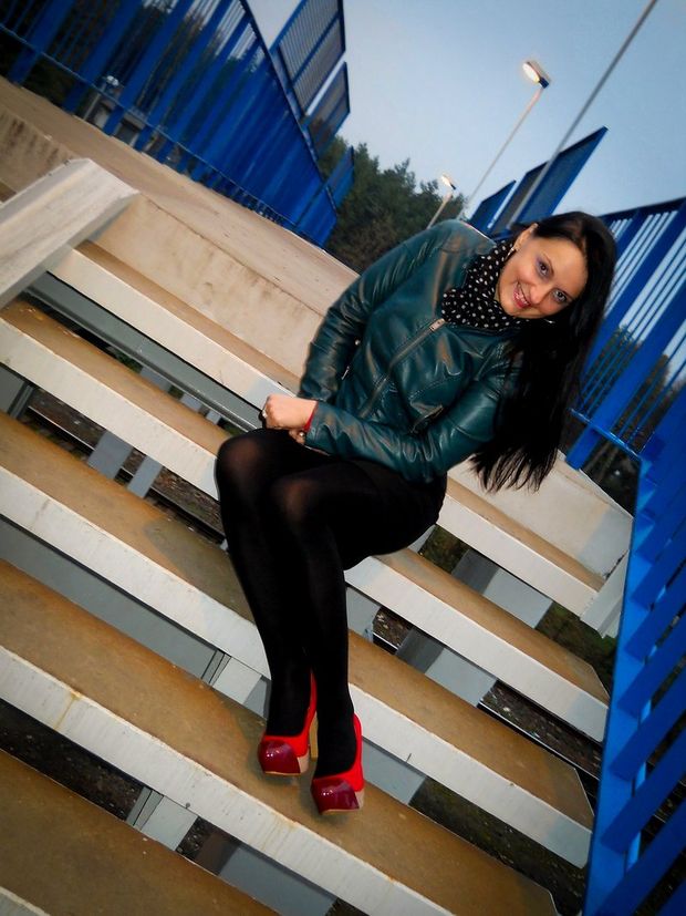 Sexy brunette posing outdoors