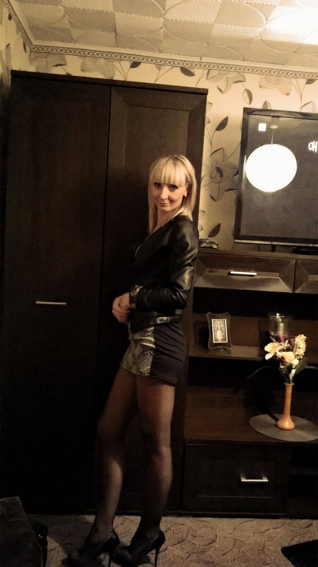 Leggy blonde chick at home