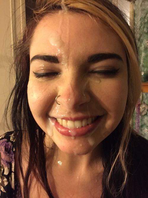 smiling because she got cum on her face