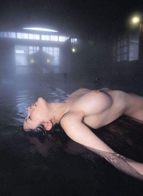 Nude Japanese Woman Floating On Her Back Exposing Her Breasts At Onsen