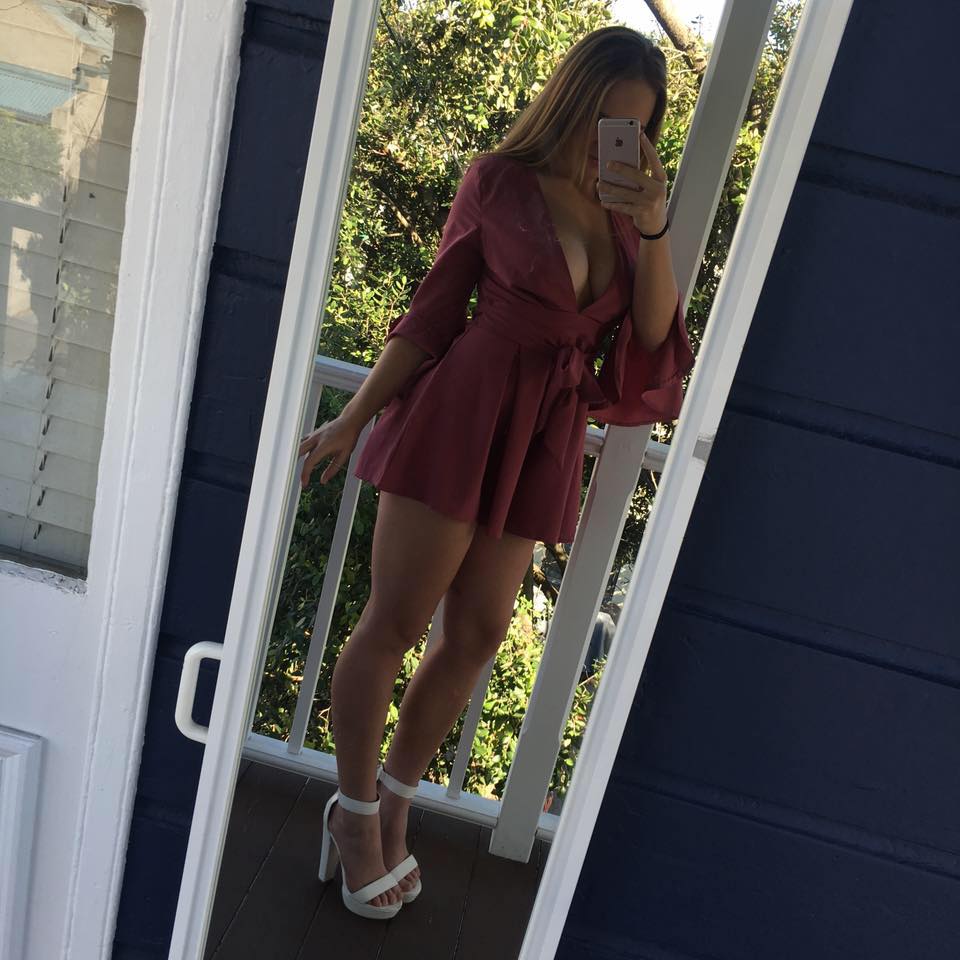 Babe taking a selfie on the balcony.