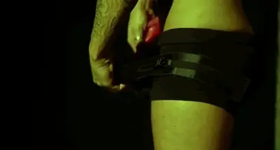 putting the dildo into the harness