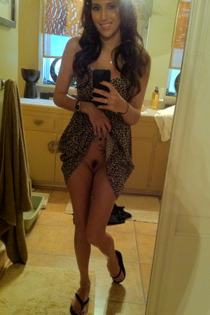 Brunette lifts her dress