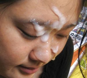 Asian amateur with face covered in cum