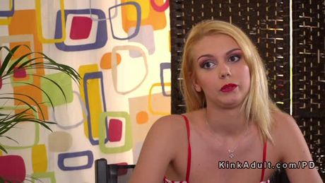 Blonde sub gets double penetration in public bar