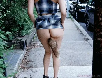 Nikki showing off her buttplug fox tail.