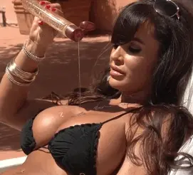 Bikini Milf Pours Oil on her Boobs