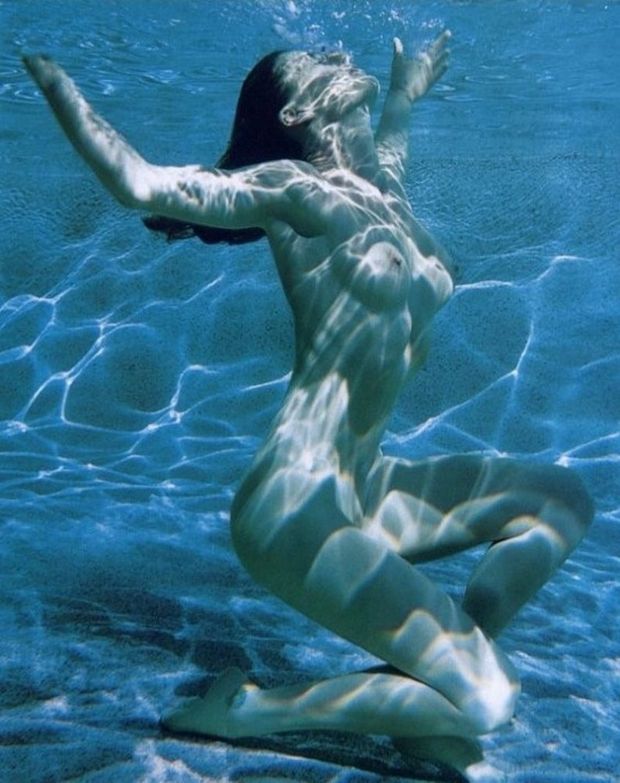 Beautiful, naked, underwater.