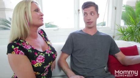 Busty blonde MILF with big tits giving a deepthroat to a stepson's big cock